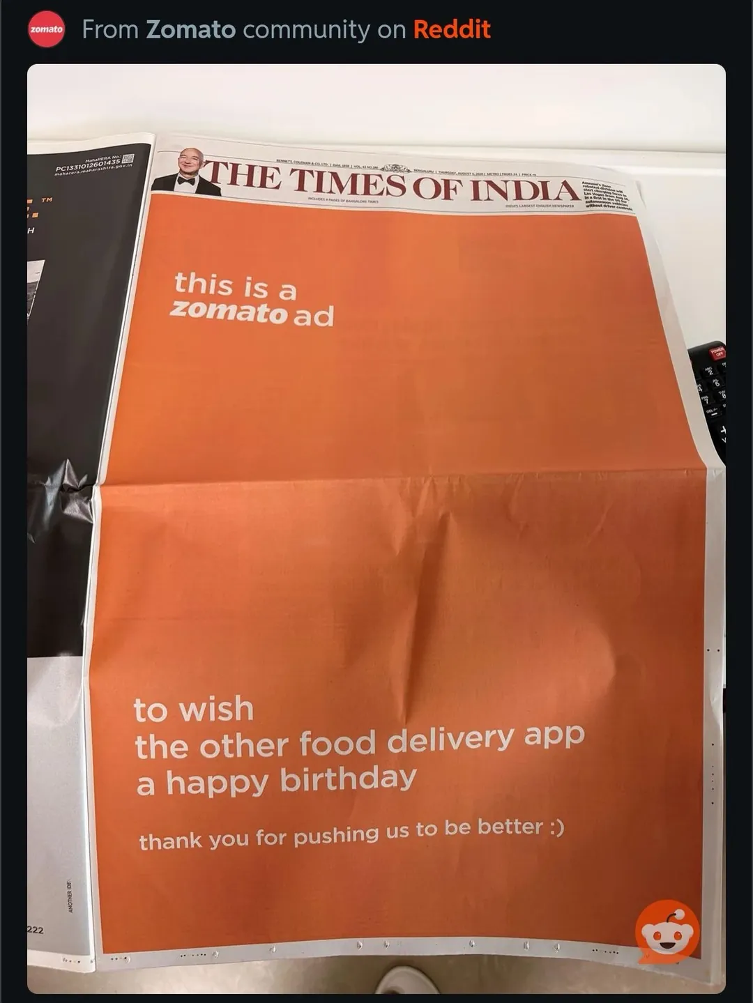 A newspaper ad from Zomato wishing a rival delivery app a happy birthday, shared from Reddit