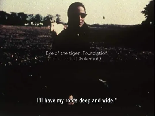 A dim film still, subtitled: I'll have my roots deep and wide